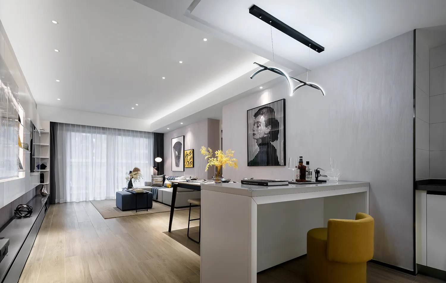 A modern living room with wooden flooring, white walls, and sleek, contemporary furniture.