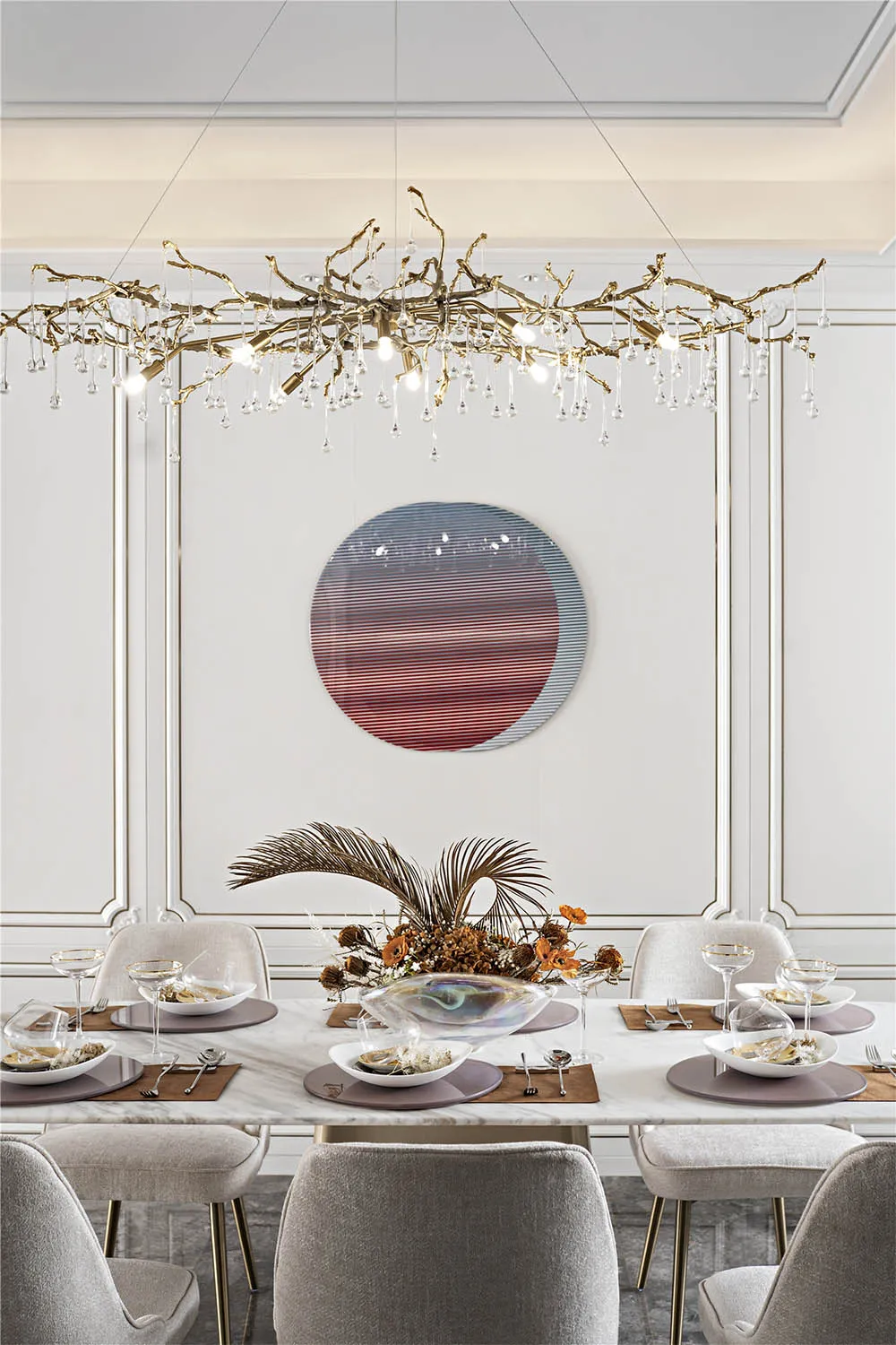 Modern dining table with marble top, grey upholstered chairs, and a unique hanging light fixture with geometric patterned wal