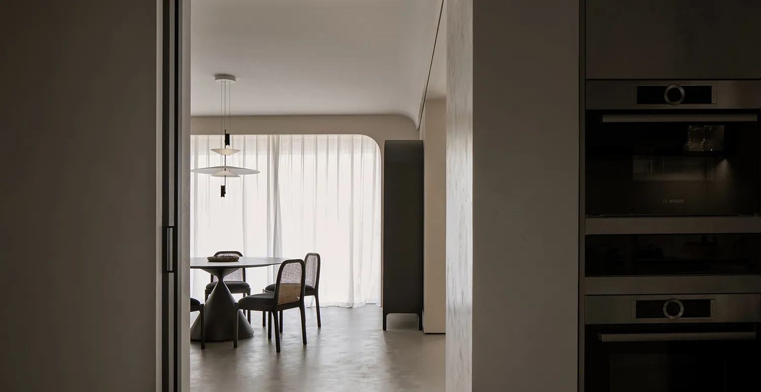 Modern residential kitchen featuring sleek concrete elements