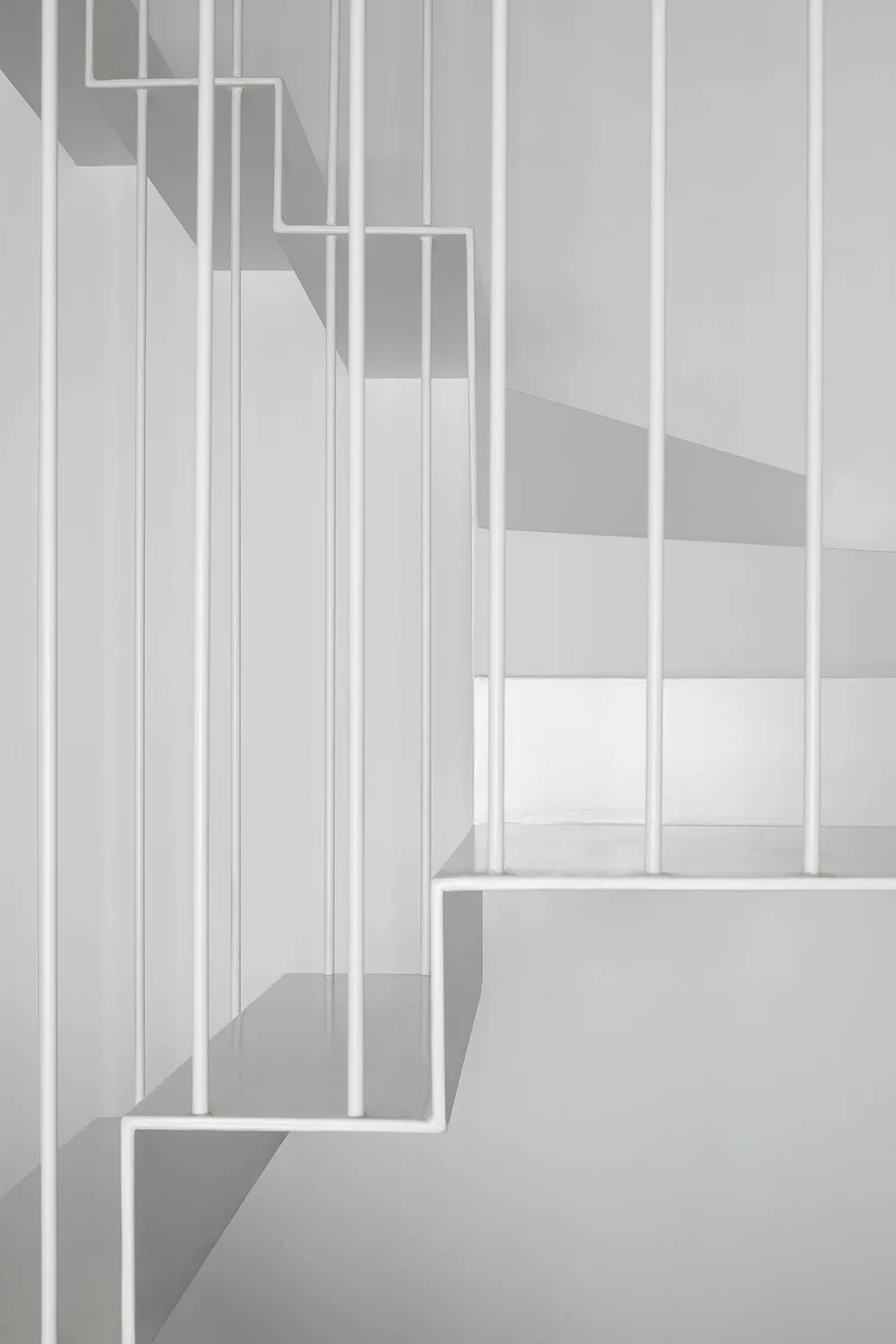 Stairs with modern minimalist design, made of metal, featuring clean lines and a sleek, contemporary aesthetic.