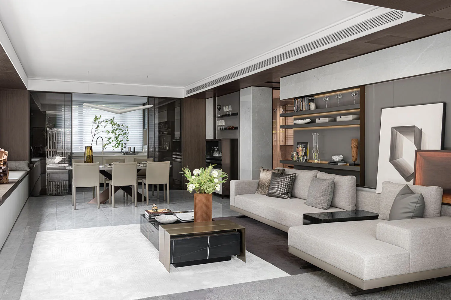Modern living room with concrete walls, minimalist furniture, and a sleek, contemporary design.