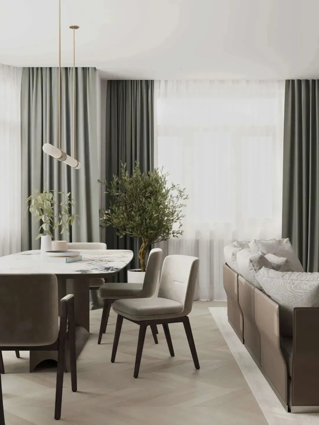 Contemporary living room featuring a marble coffee table surrounded by upholstered chairs and a modern sofa with pillows.