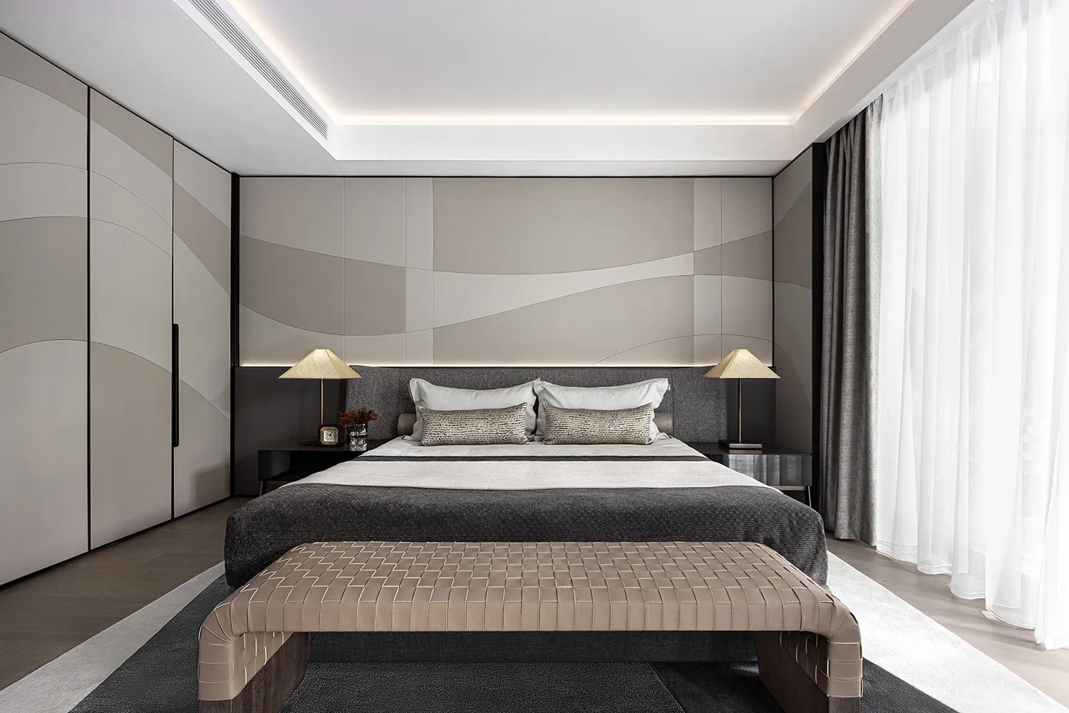 Modern minimalist bedroom with fabric, leather, and metal accents