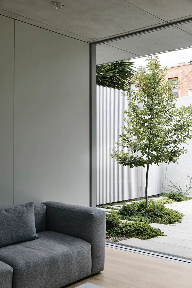 Modern minimalist living room featuring aluminum and wooden walls