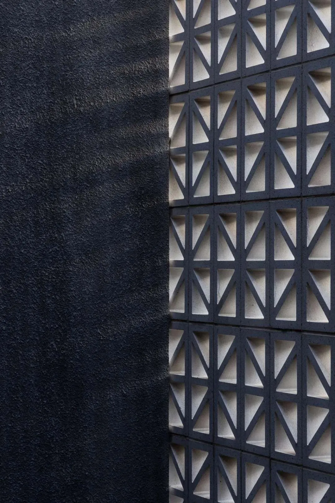 A concrete wall with geometric patterns