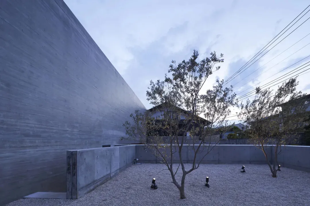 Modern residential space with concrete walls and minimalistic design.