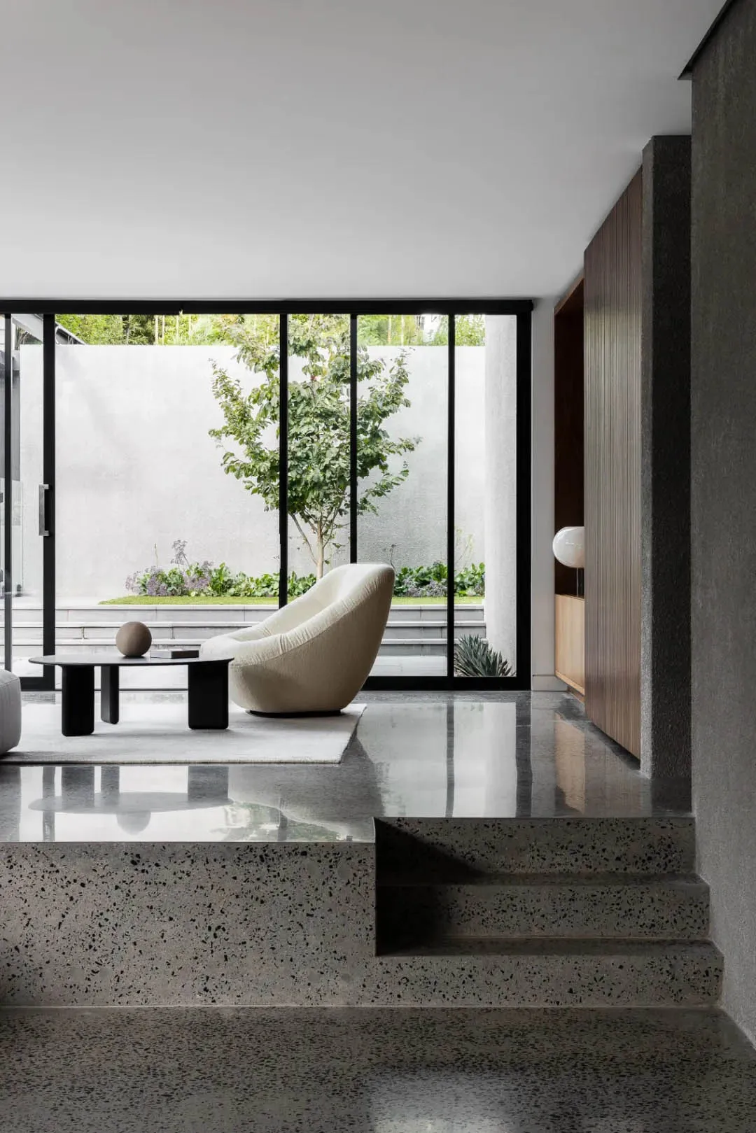 Modern interior space featuring a sleek, minimalist design with concrete as the primary material.