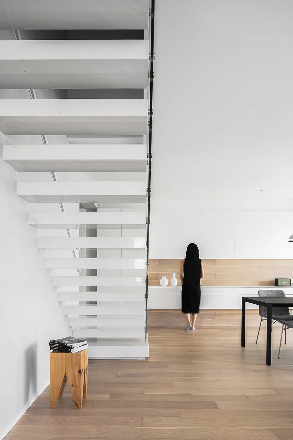 A modern interior designed with minimalist elements and concrete finishes.