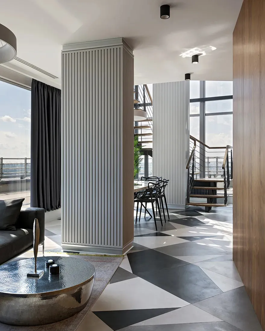 Modern living room featuring metallic geometric flooring with a contemporary aesthetic.