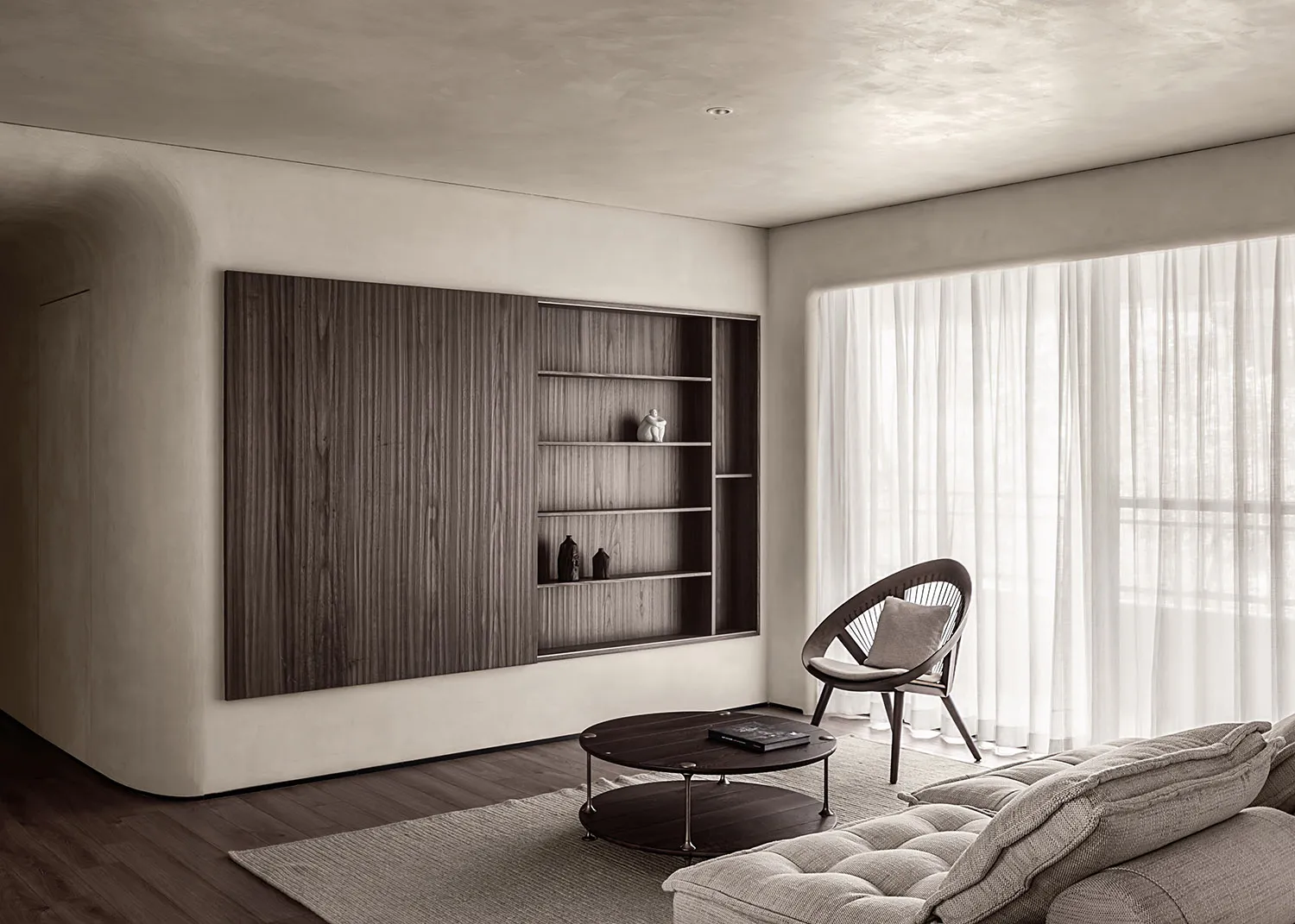 A minimalist living room featuring wooden furniture, glass accents, and a comfortable seating area.