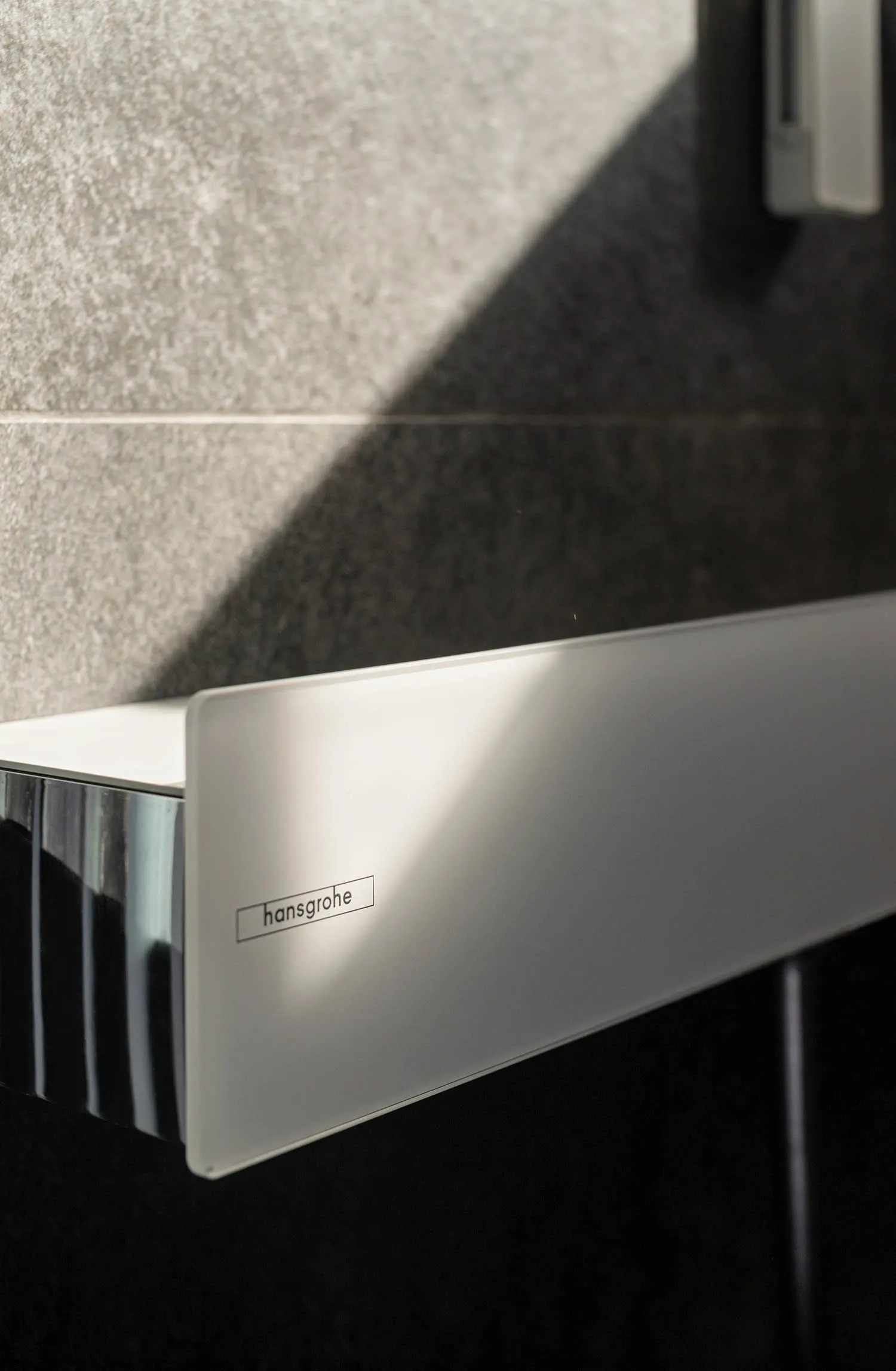 Translucent glass privacy screen in a minimalist bathroom setting.