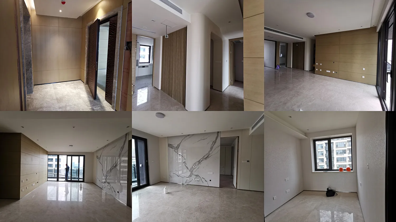 A modern interior space featuring marble flooring and minimalist design elements.