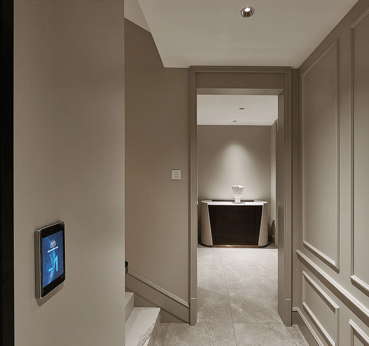 Modern corridor with marble flooring and walls.