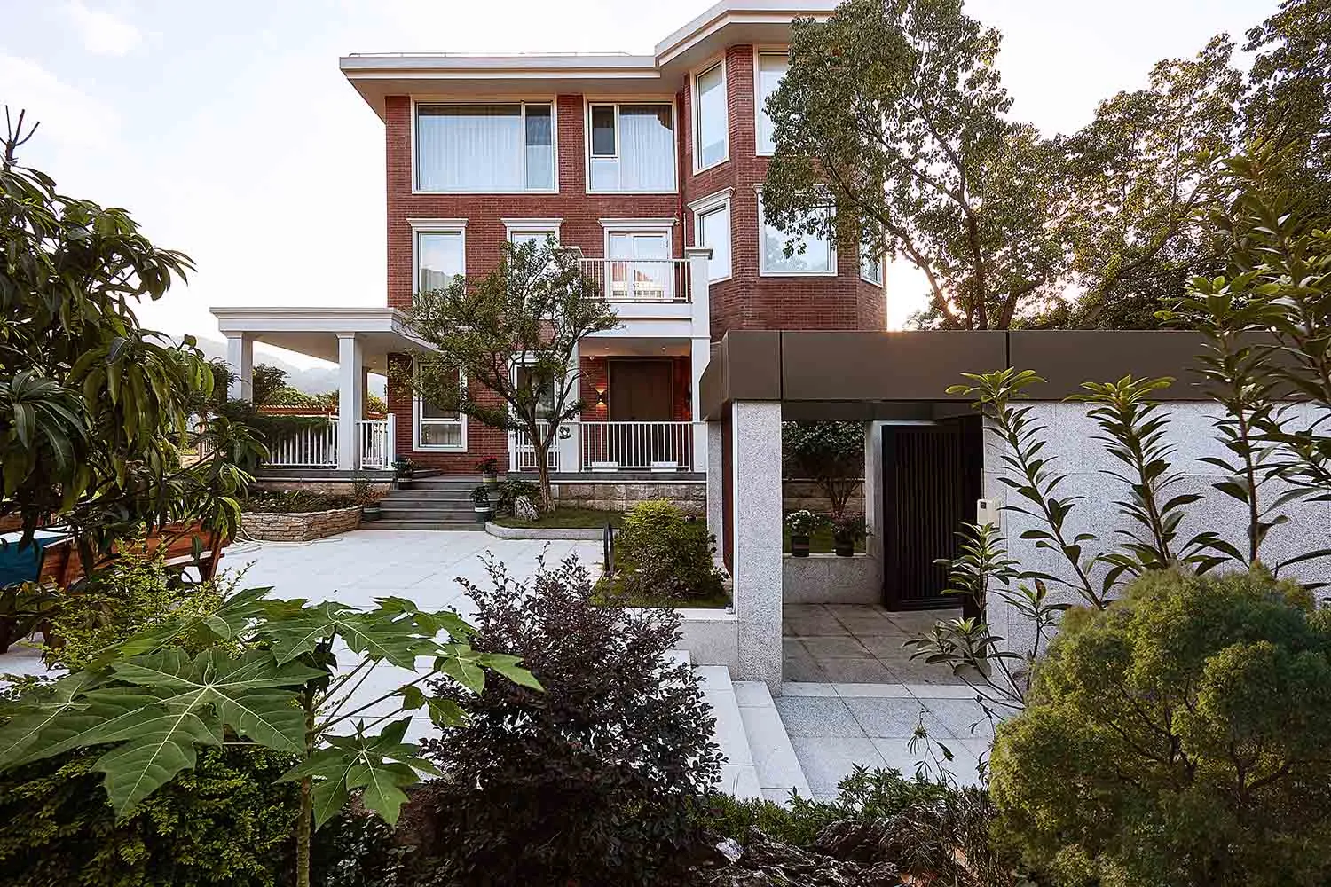 Modern residential exterior showcasing brick and glass materials