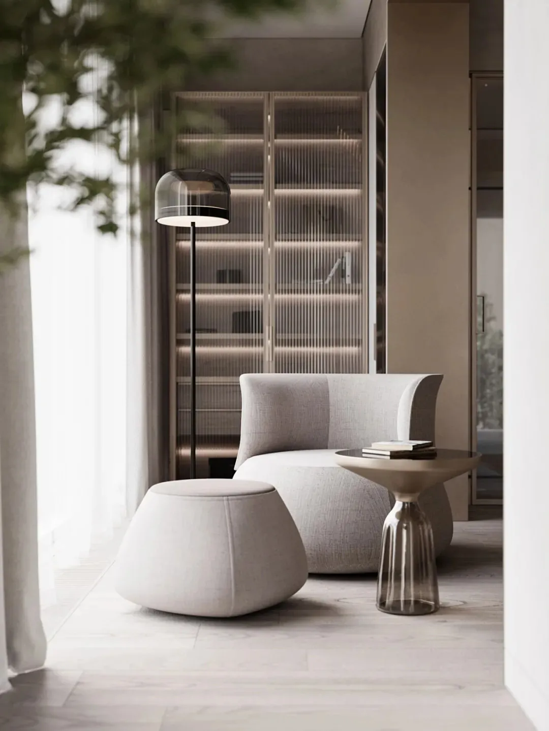Modern minimalist living room featuring textured upholstery, a sleek floor lamp, and a small glass table with books.