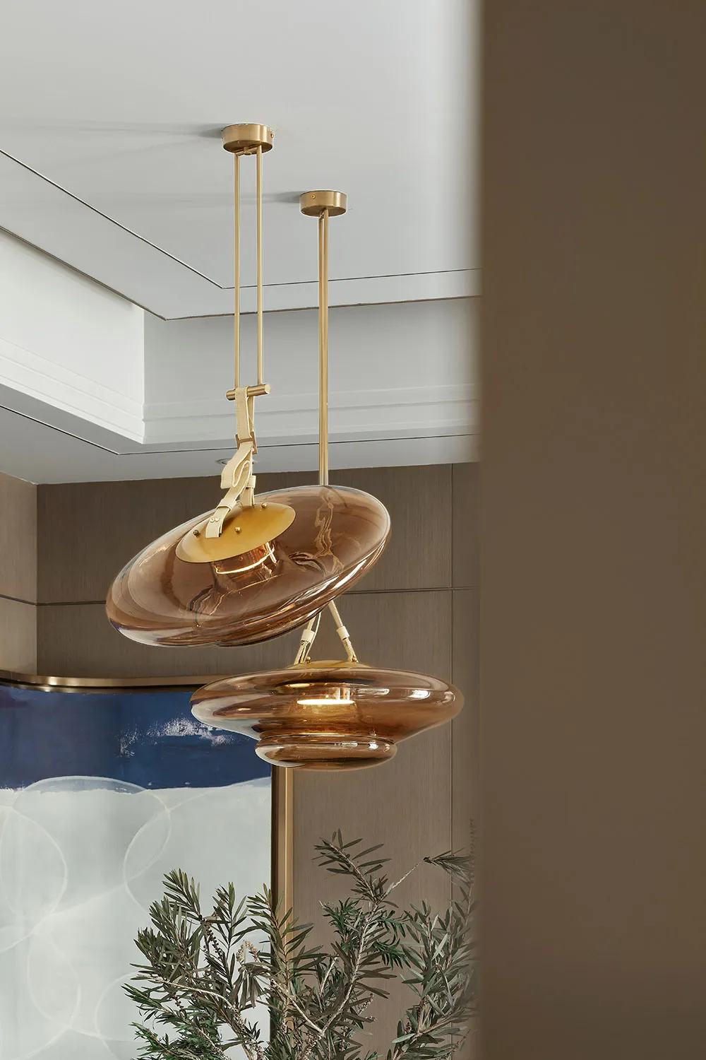 Modern interior design featuring glass lighting fixtures.