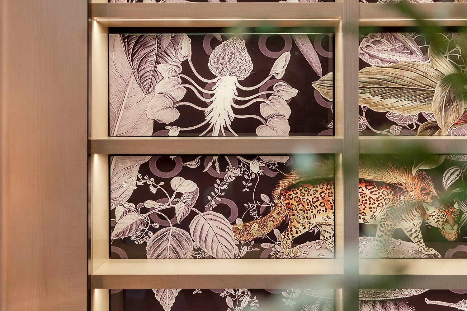 Decorative jungle-themed fabric wall panels with animals and botanical patterns.