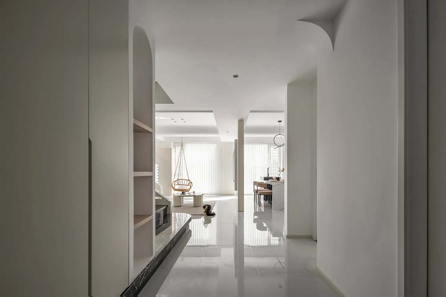 A contemporary living room with white marble flooring, minimalist decor, and a modern lamp.