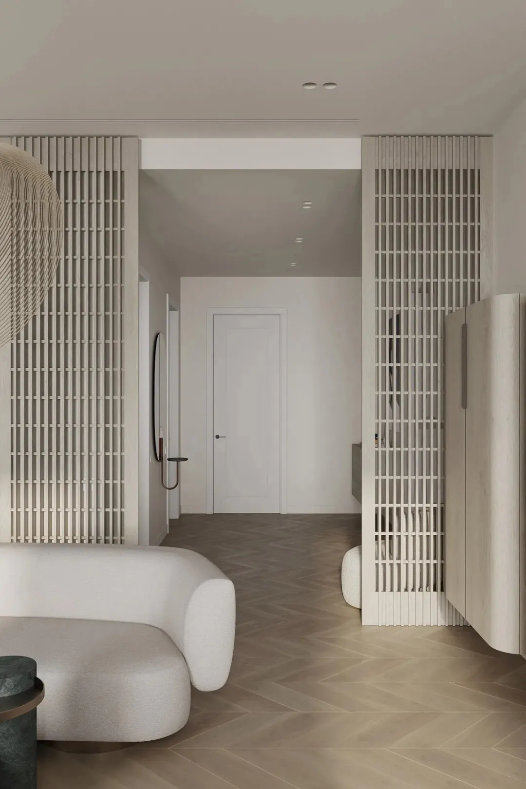 A minimalist living room with neutral-toned materials and modern furniture.