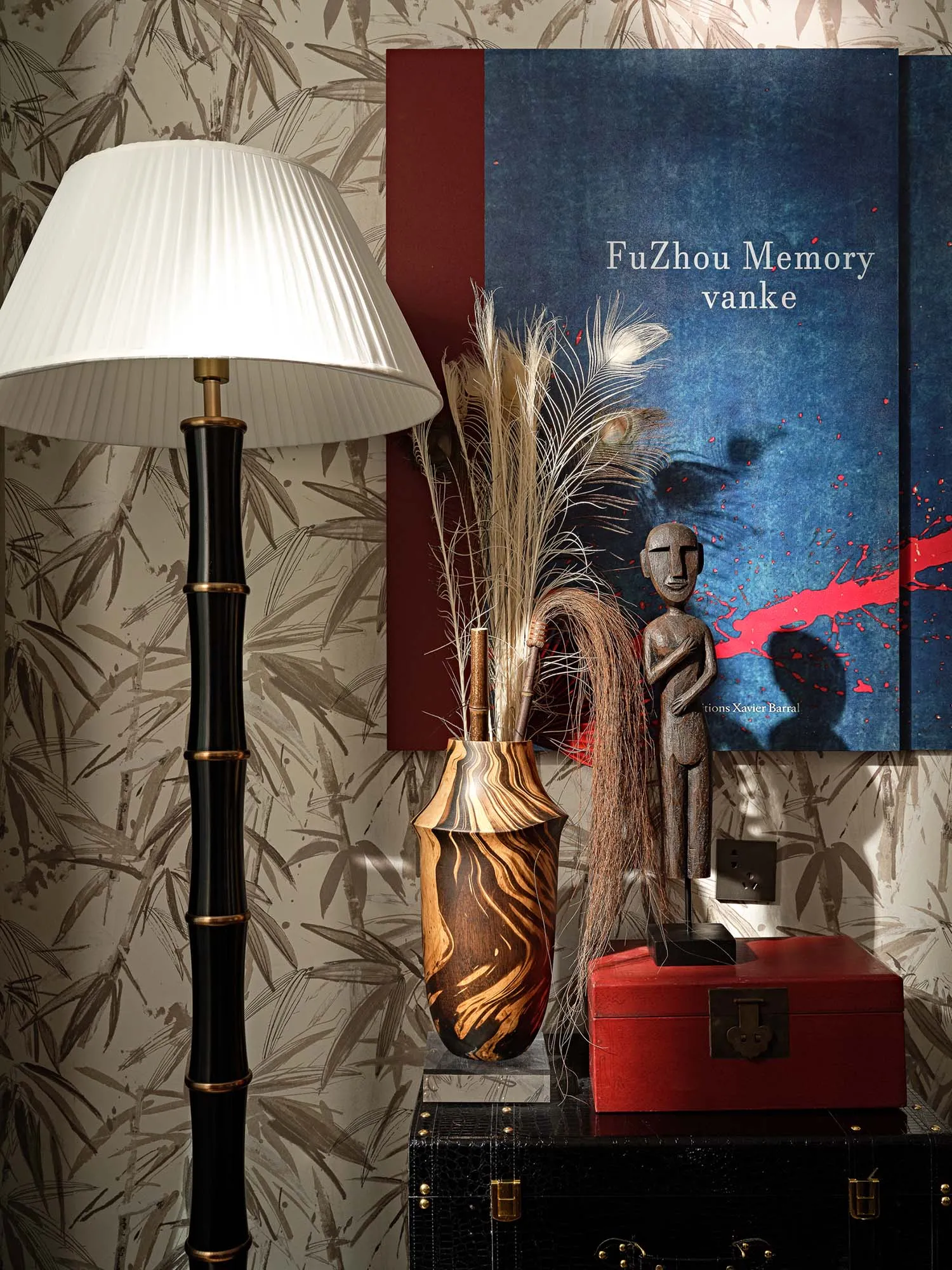 A modern room featuring decorative objects made of wood, including a floor lamp with a white shade, a wooden vase with dried