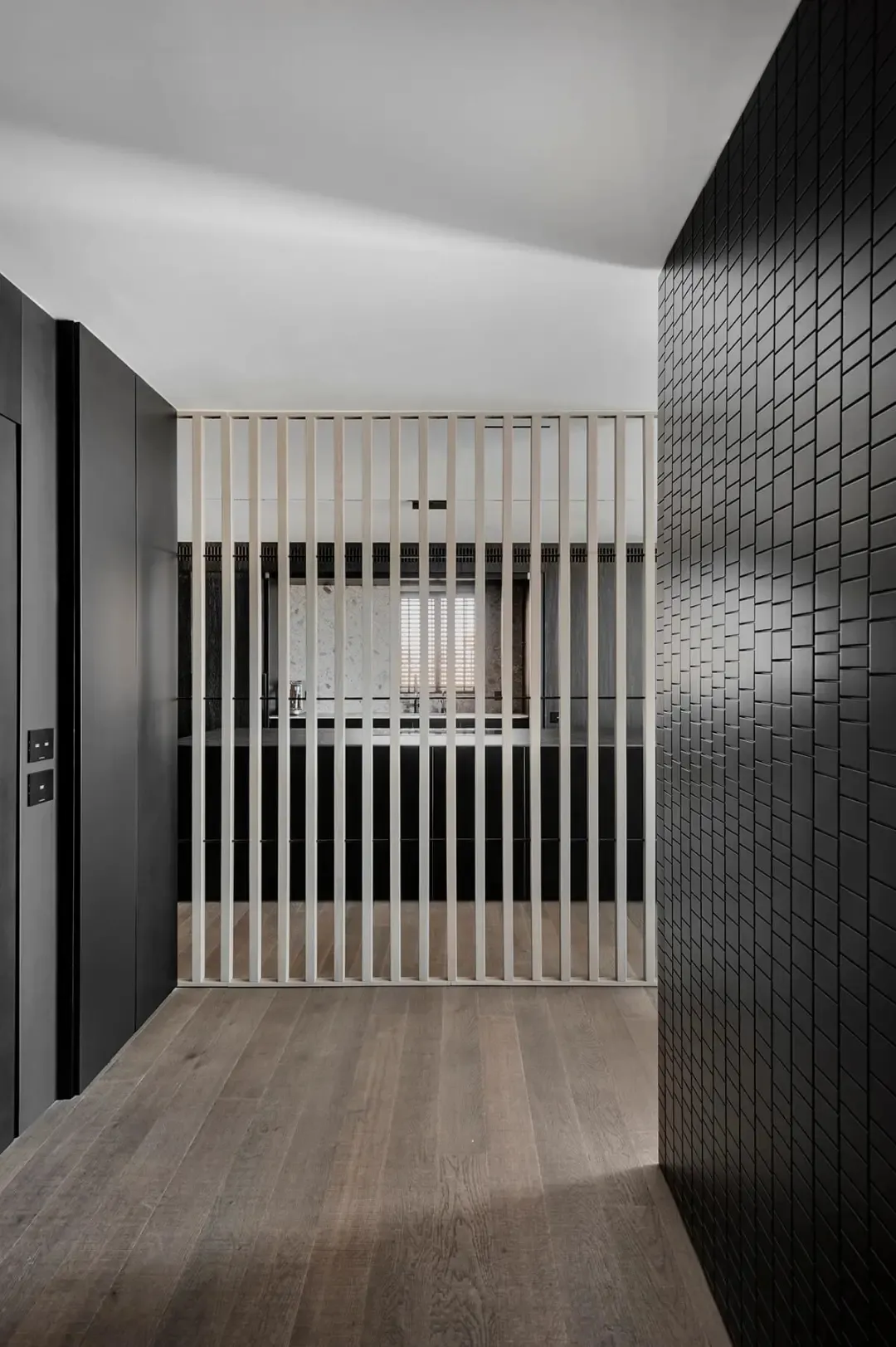 Modern industrial office space featuring minimalist design, metal and glass walls, and sleek furniture.