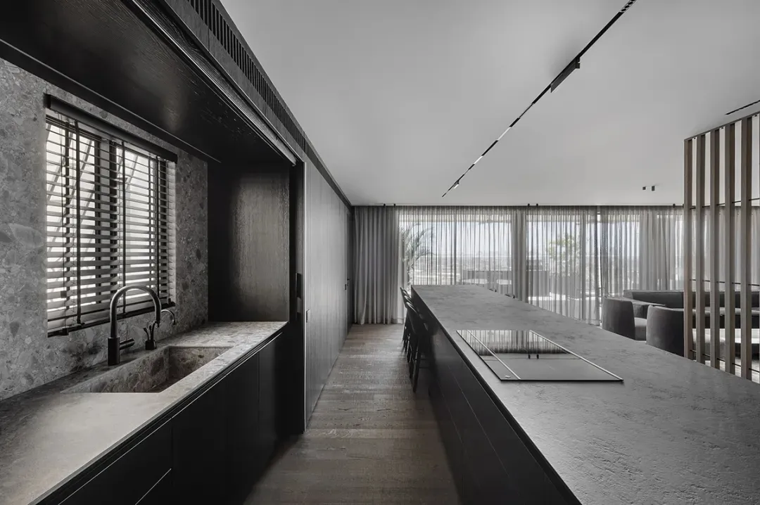 Modern kitchen with granite countertops and minimalist design