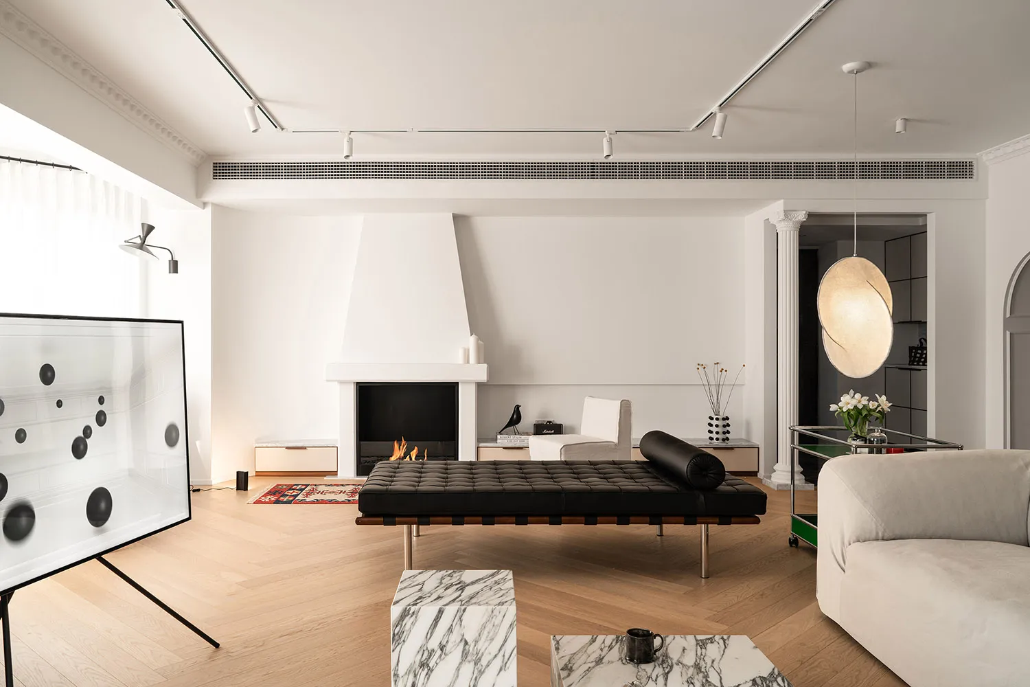 Modern minimalist living room adorned with marble furniture and accents for sophistication and elegance.