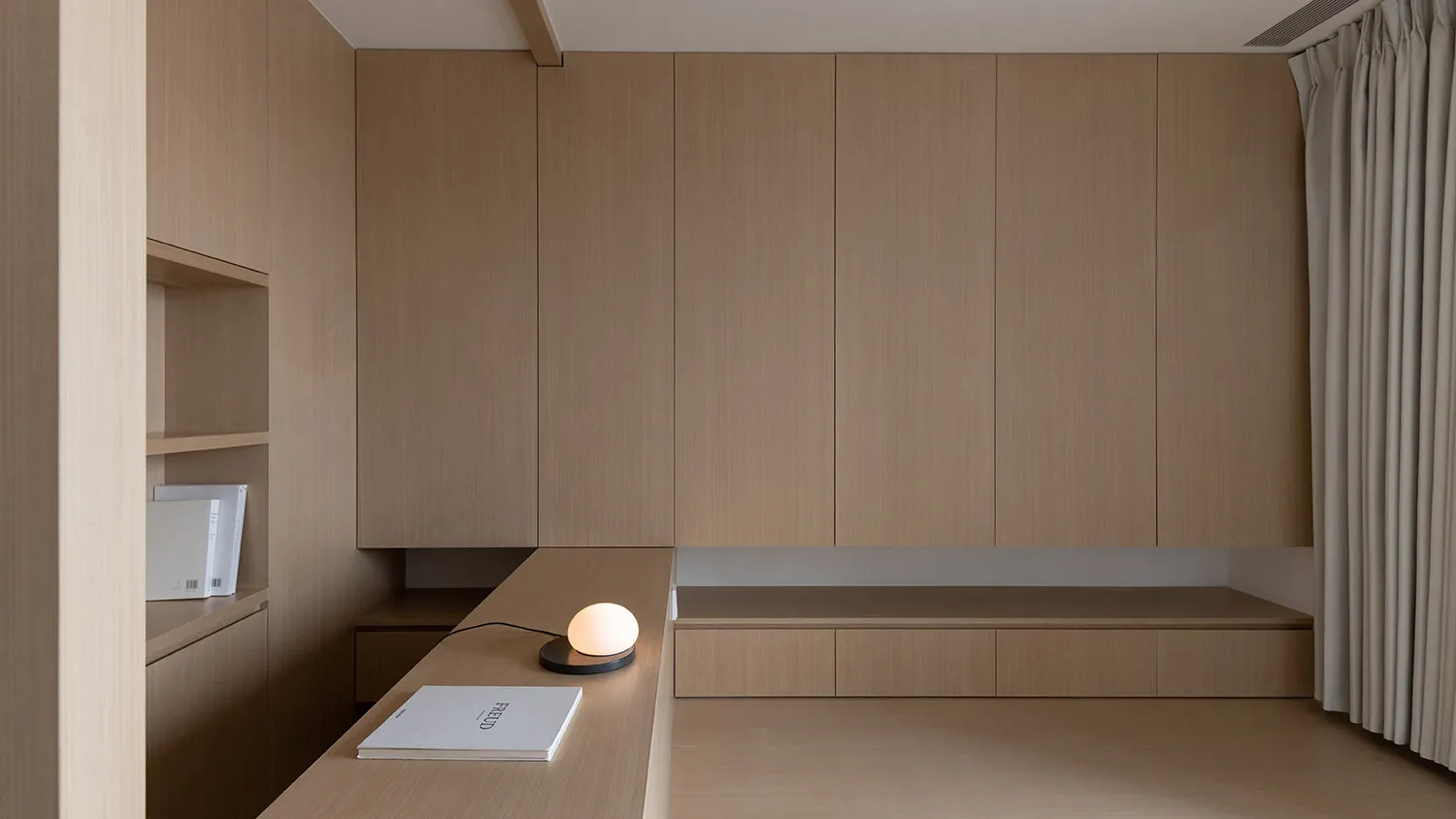 A minimalist interior design featuring natural wood elements and clean lines.