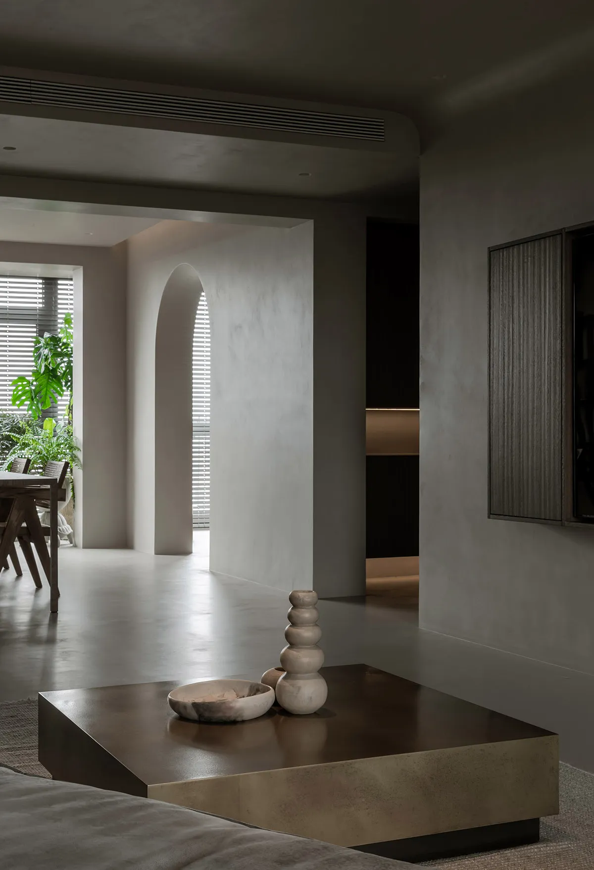 Minimalist living room featuring concrete elements.