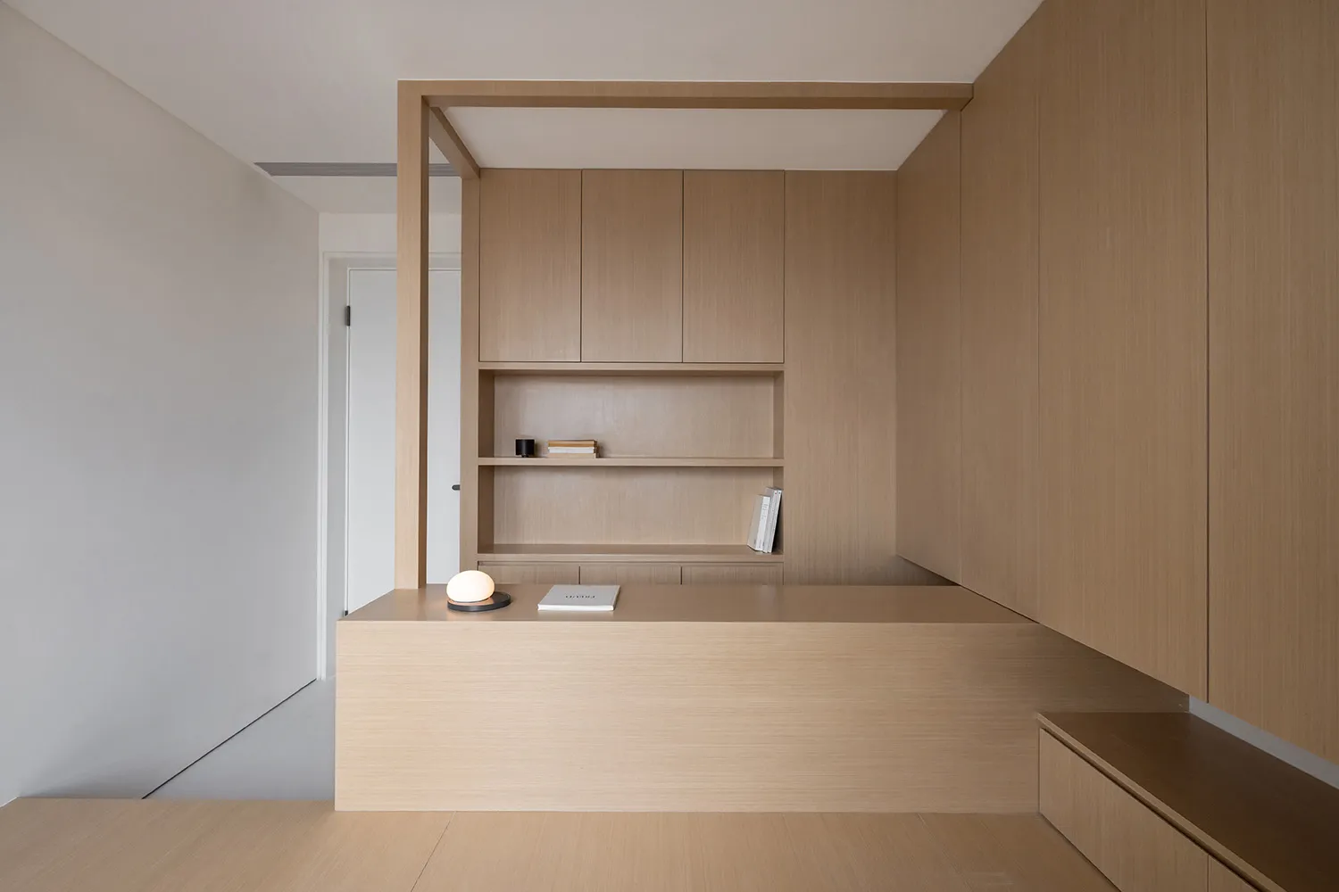 Modern minimalist living room featuring wood elements and minimalist design.