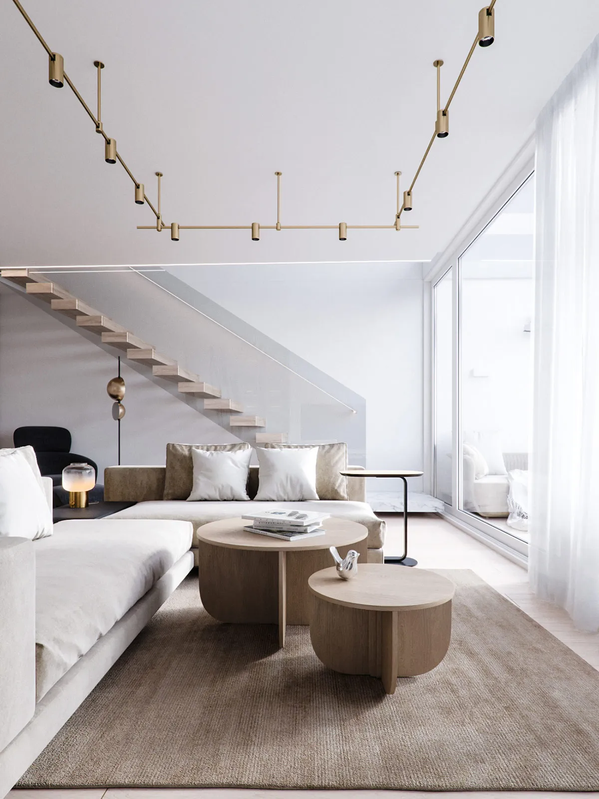 Modern minimalist living room with white sofas, round wooden tables, and golden light fixtures.