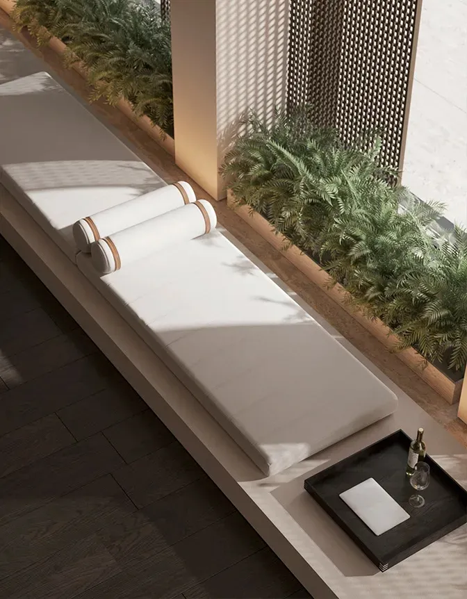 Modern minimalist relaxation space featuring wood cushions and greenery.