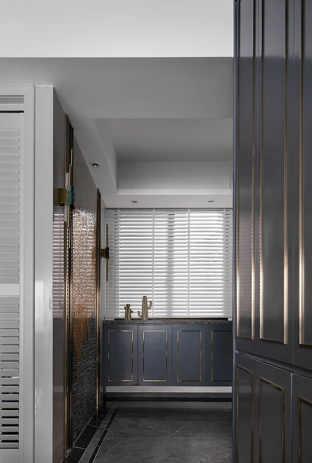Modern industrial kitchen features metallic accents in a minimalist design.