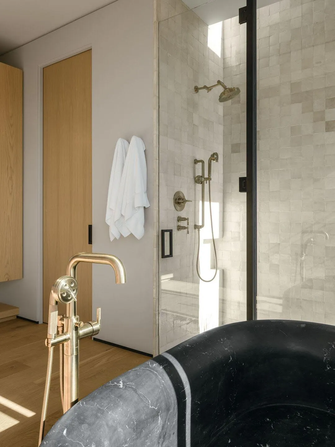 Modern bathroom interior featuring marble materials and contemporary fixtures.