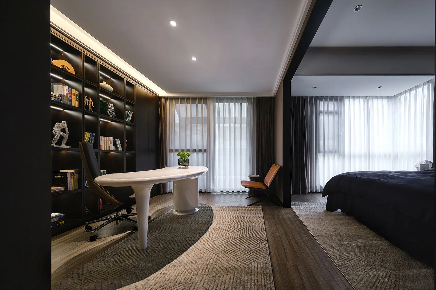 A modern bedroom featuring wooden furniture and a carpeted floor.