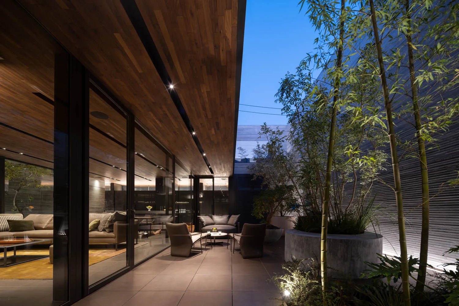 A modern living room with concrete and wooden materials