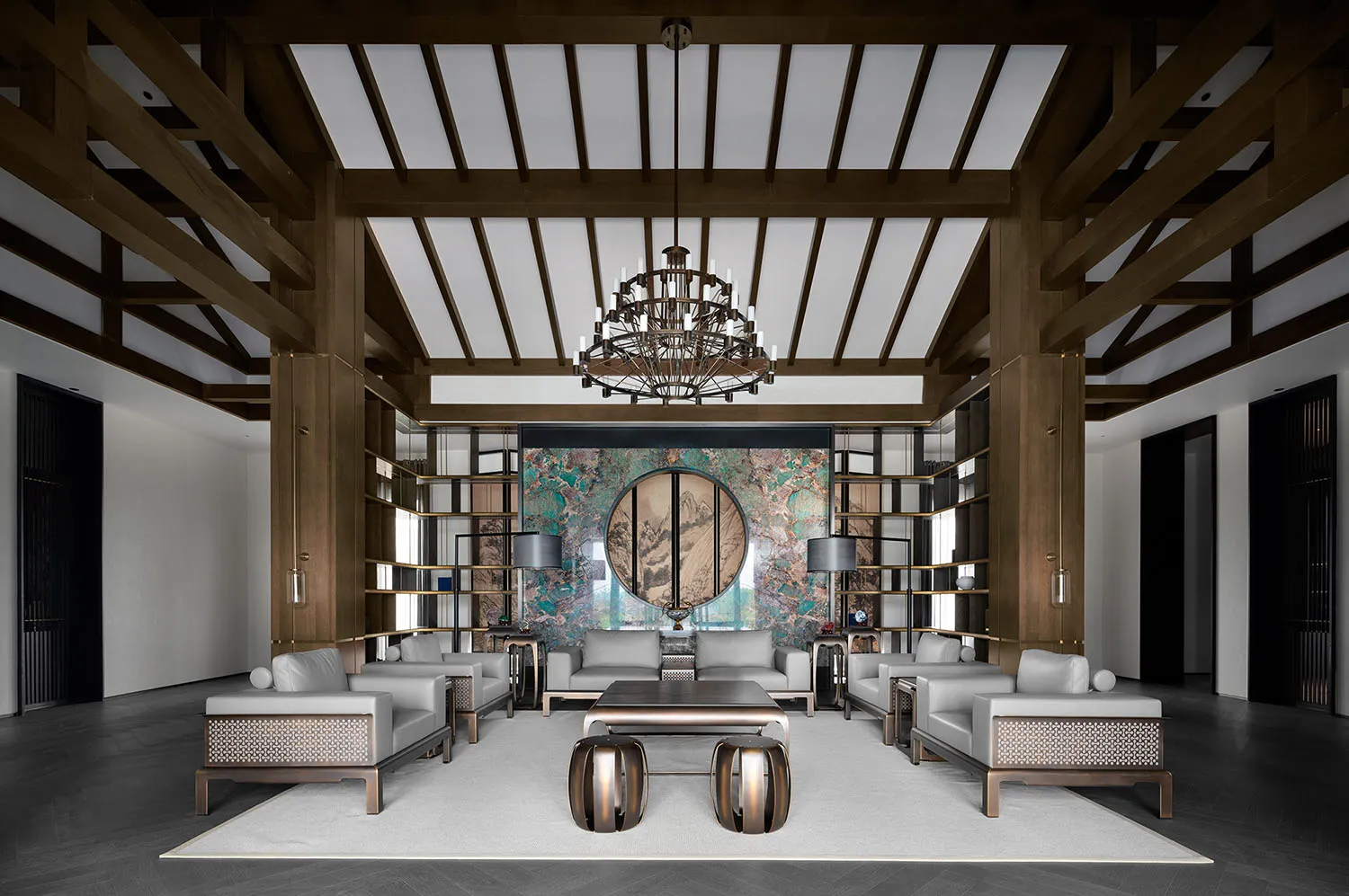 Earthy, modern lounge designed with marble, wood, and metal elements