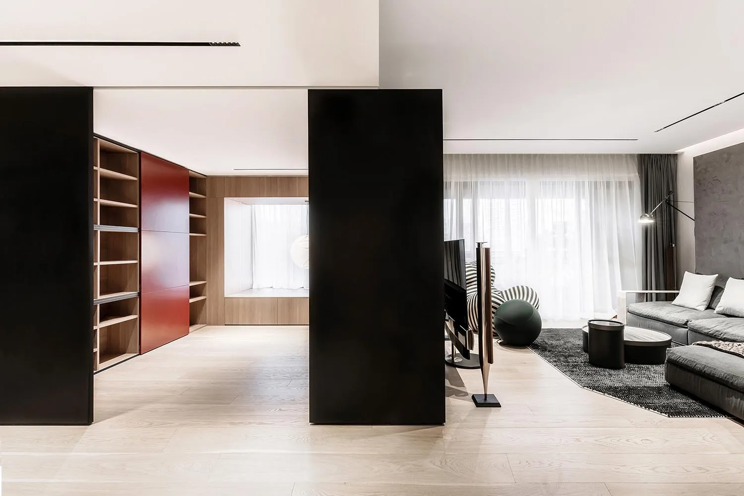 Modern living room designed with wood, metal, and fabric elements.