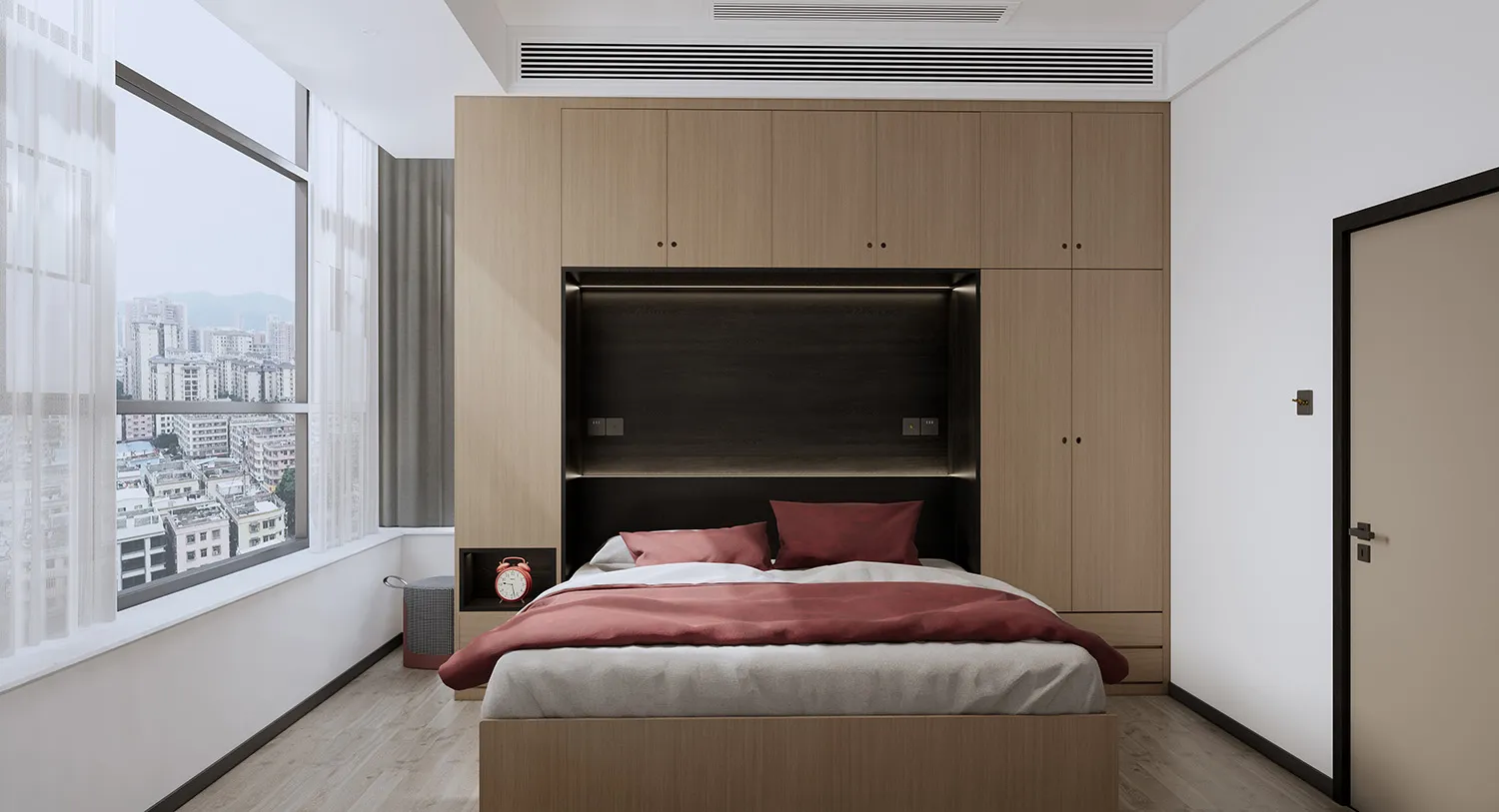 A minimalist bedroom with a bed, red bedding, and white curtains.