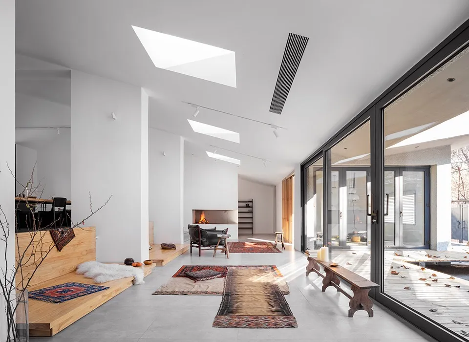Minimalist living room featuring concrete and wood elements