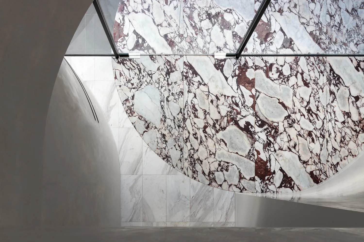 Modern interior space featuring marble walls and flooring