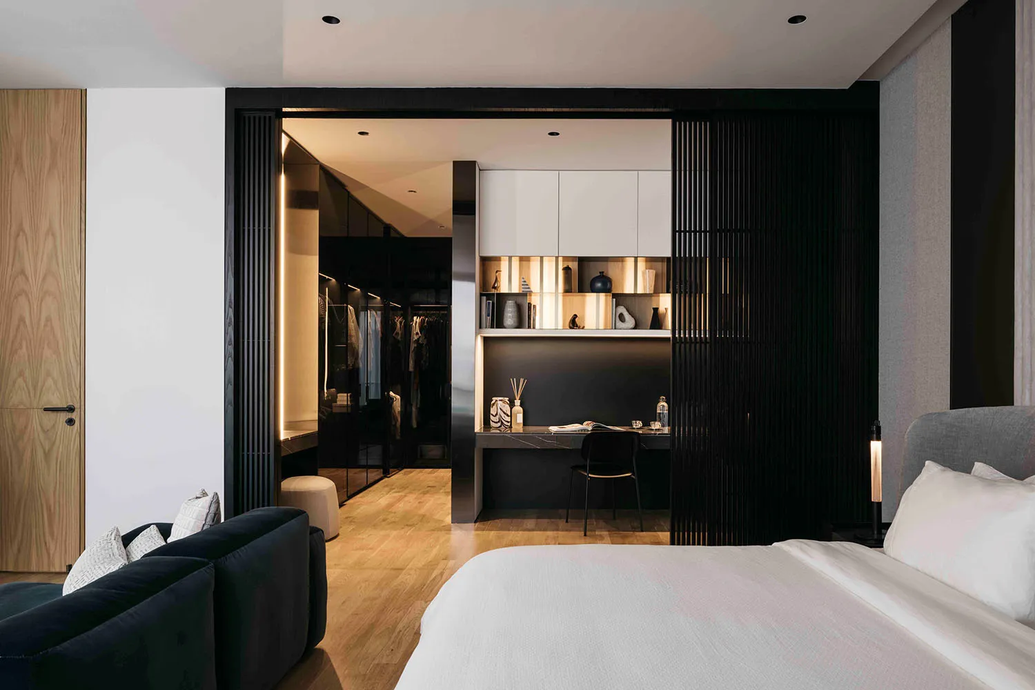 Modern bedroom featuring muted color palette, minimalist design, and elegant interior details.