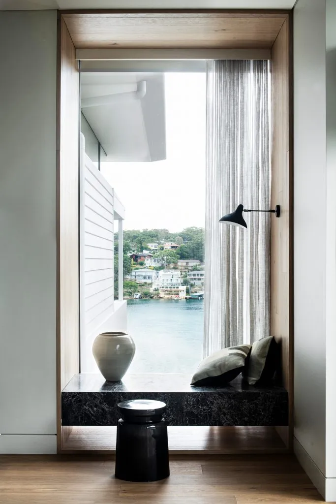 Modern interior with marble window ledge and view of water