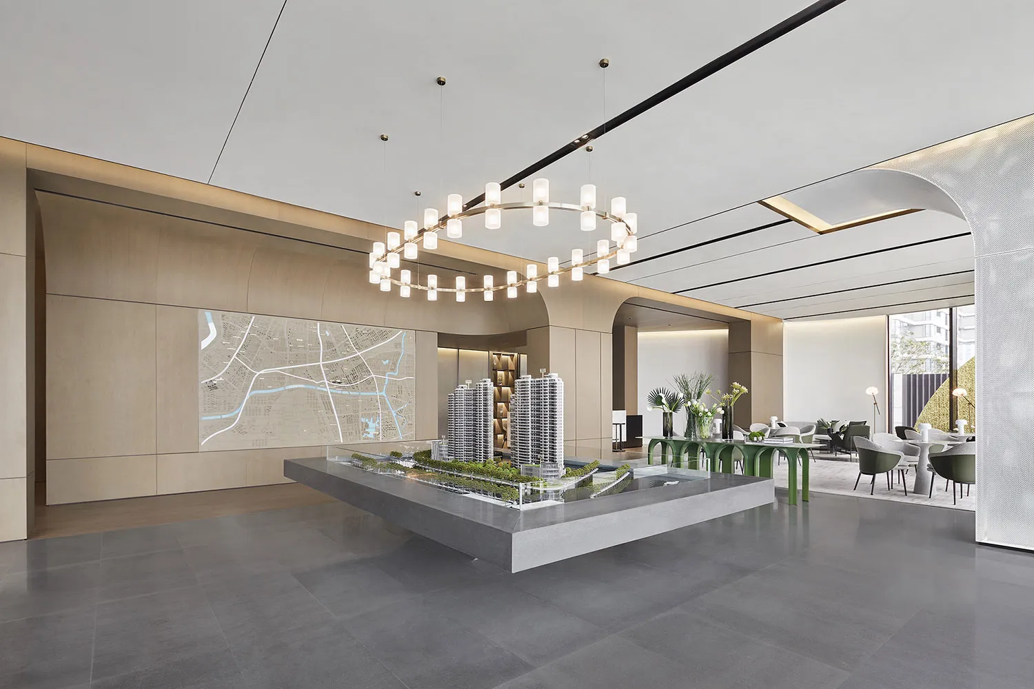 A modern lobby interior with a concrete architectural model.