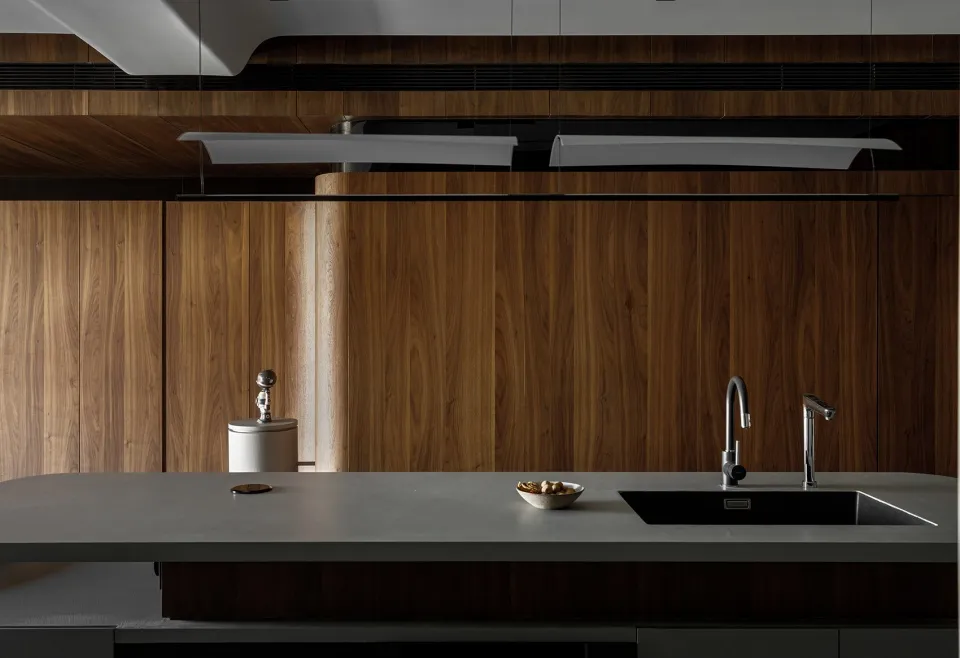Modern interior design featuring wooden cabinets and a white countertop.