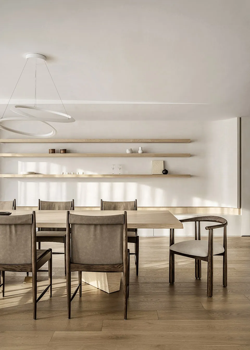 Modern minimalist dining room featuring wood furniture and clean lines.