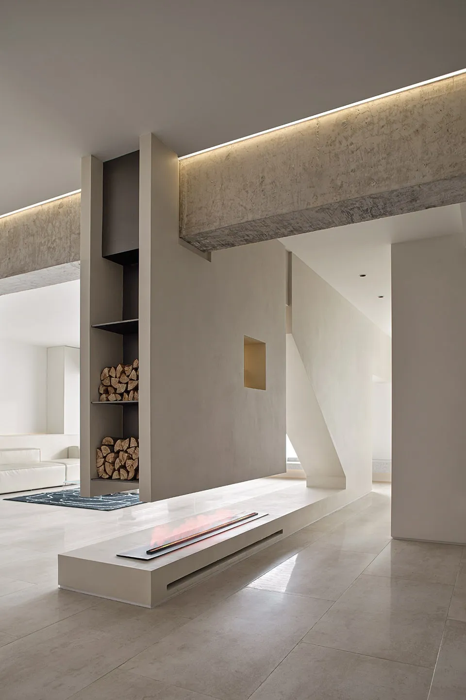 Modern living room with concrete fireplace and minimalist design