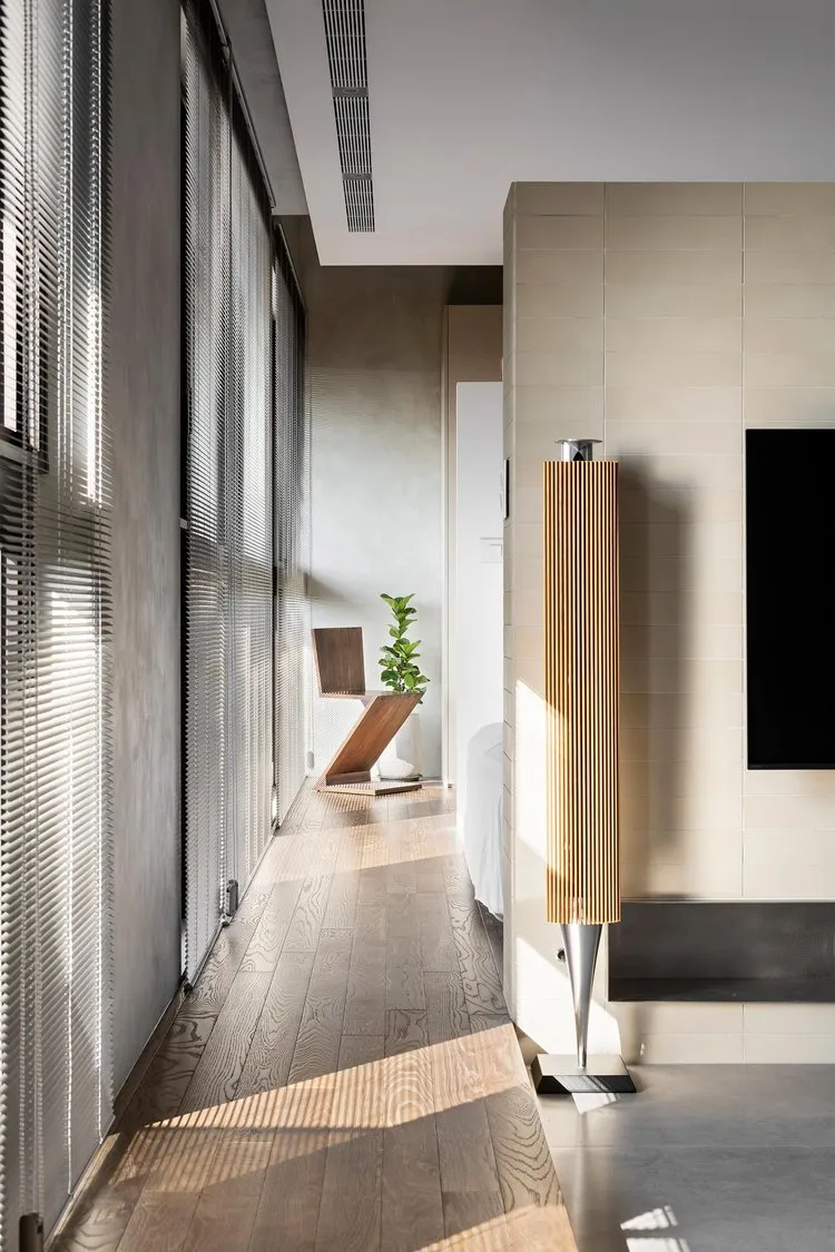 Modern minimalist living room with wooden furniture and flooring.