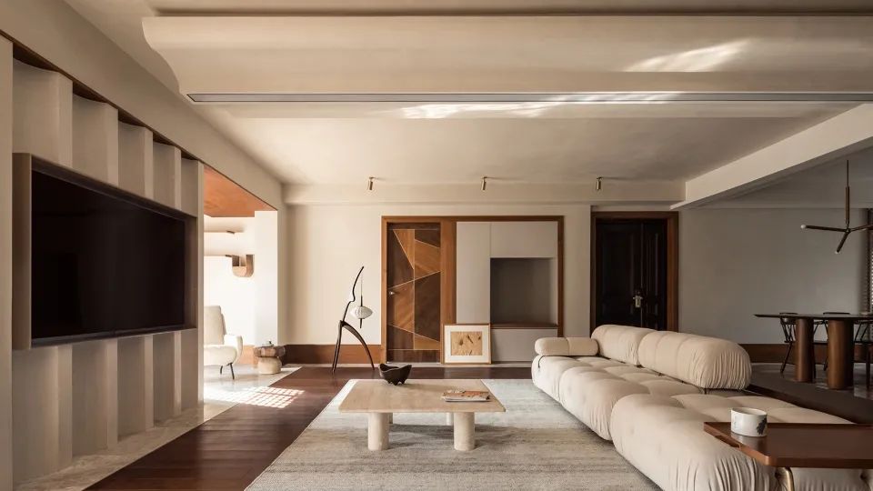 Modern residential living room featuring concrete and wood materials.