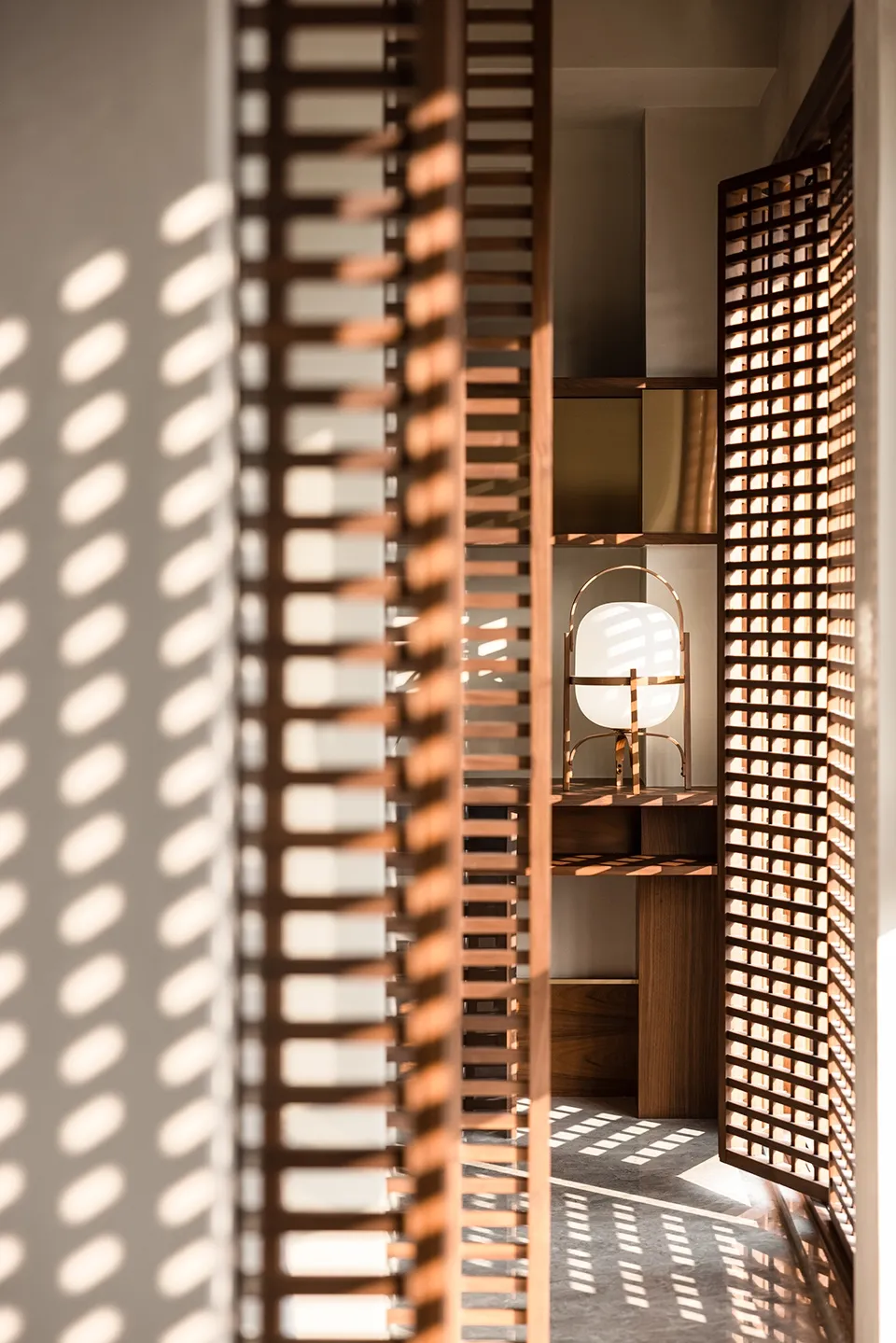 A modern retro lamp with a wooden frame, positioned in a minimalist setting with light-colored walls and a wooden floor.